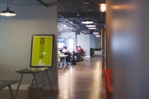 Contemporary open office space with people collaborating and working together.